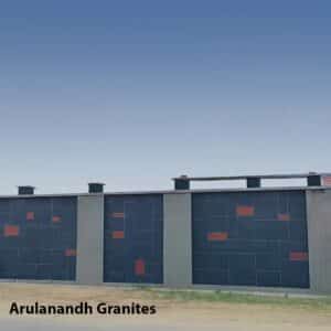 Granite wall installation with modern grid pattern and red accent blocks