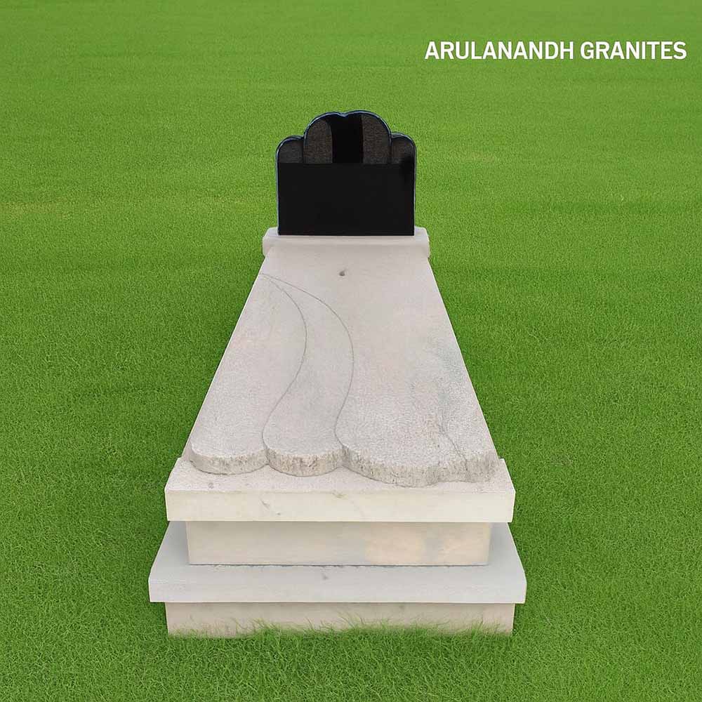 Granite tombstone with scalloped slab, double-arched black headstone